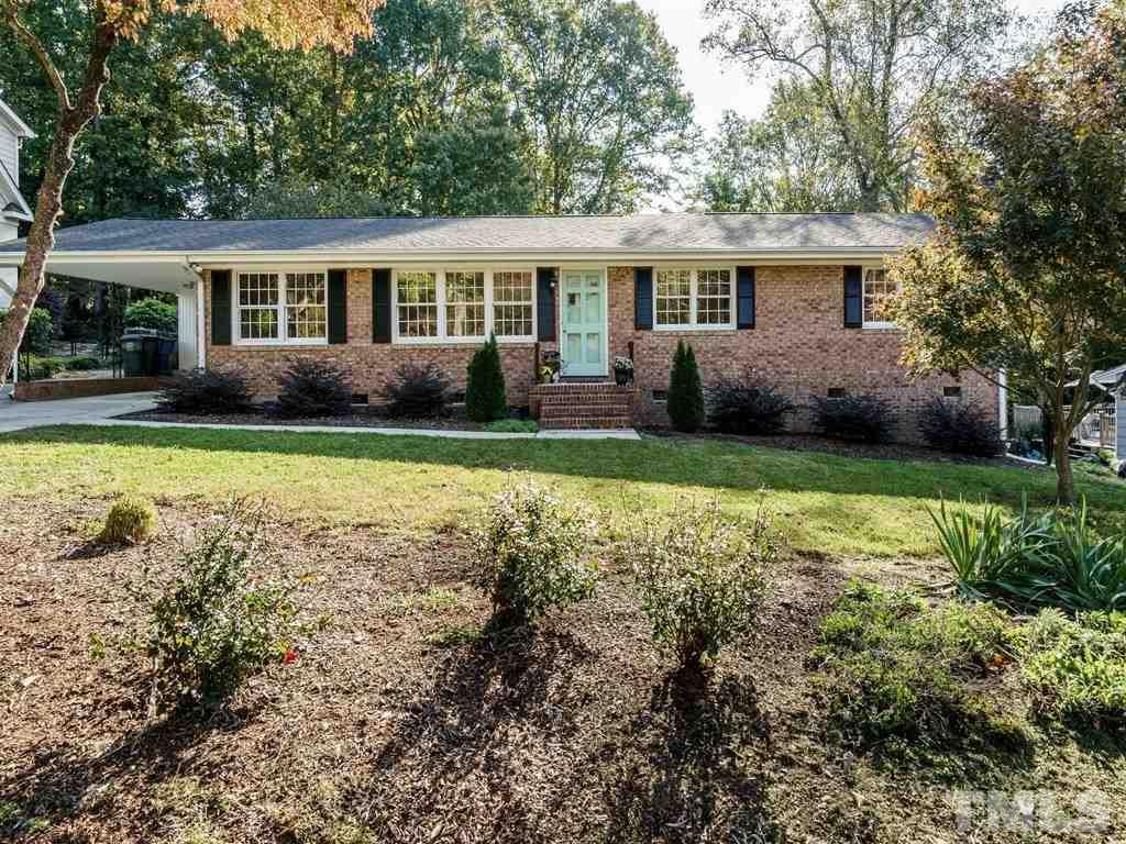 4224 Rowan Street Raleigh, NC 27609 - Photo 1 of 24 a view of a house with a yard and swimming pool