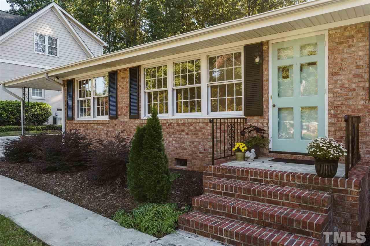 4224 Rowan Street Raleigh, NC 27609 - Photo 2 of 24 a front view of a house with garden