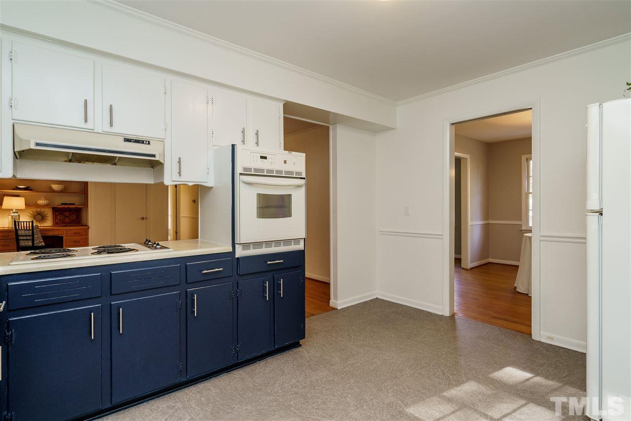 4224 Rowan Street Raleigh, NC 27609 - Photo 12 of 24 a kitchen with stainless steel appliances a sink and cabinets