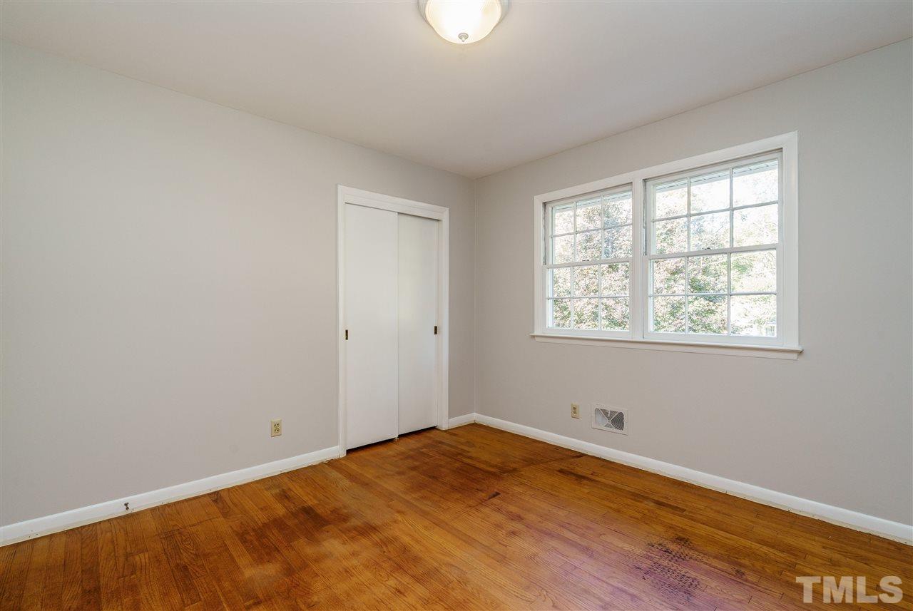 4224 Rowan Street Raleigh, NC 27609 - Photo 21 of 24 a view of a room with wooden floor and windows
