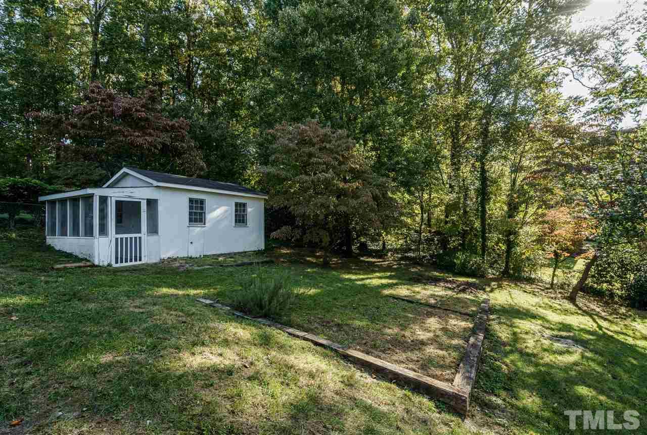 4224 Rowan Street Raleigh, NC 27609 - Photo 23 of 24 a view of a yard in front of a house with large trees