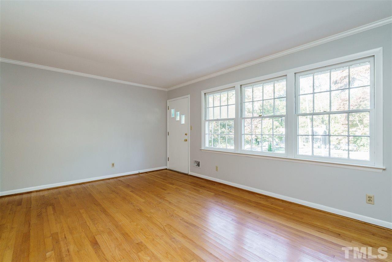 4224 Rowan Street Raleigh, NC 27609 - Photo 5 of 24 an empty room with a window