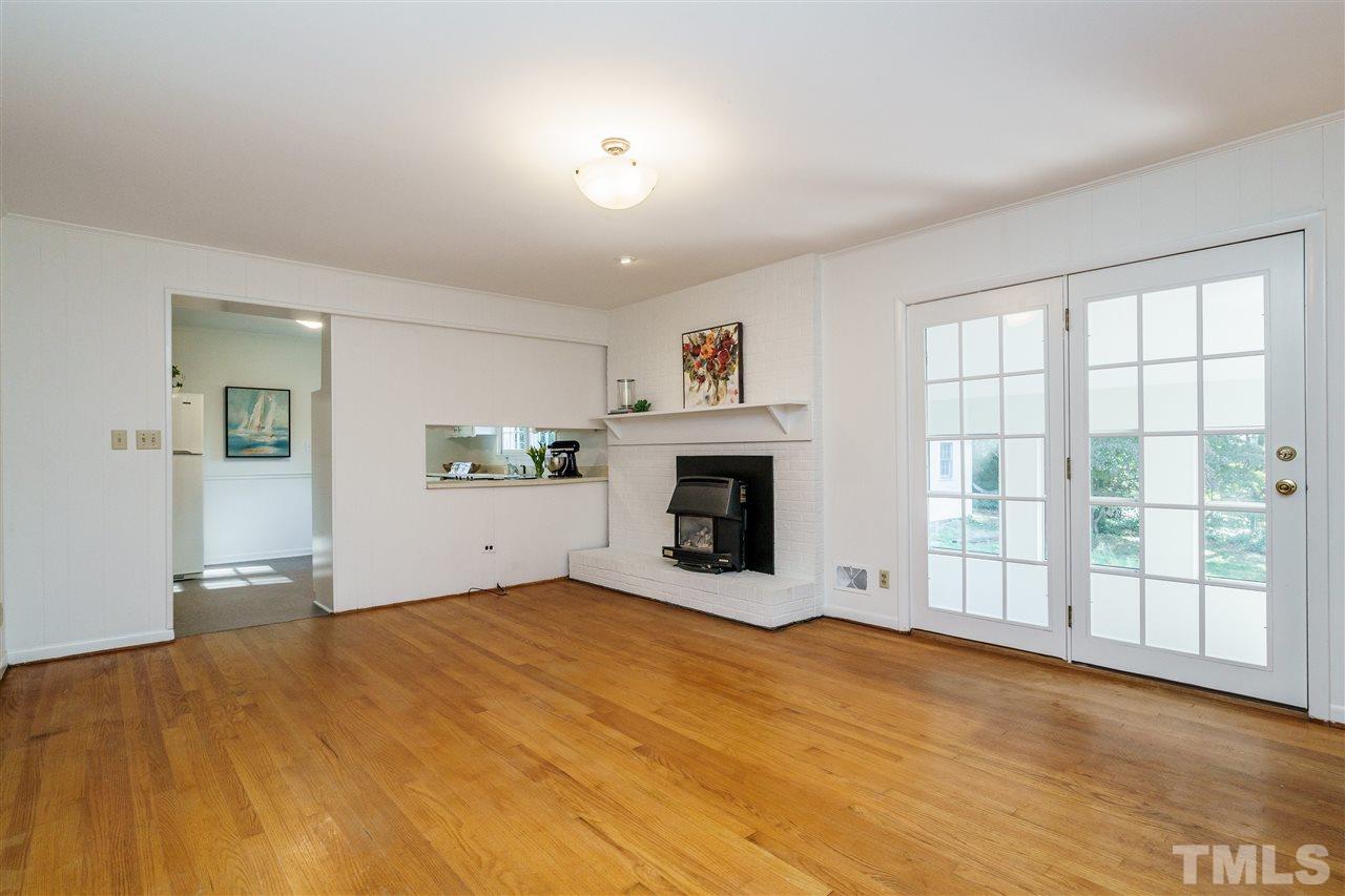 4224 Rowan Street Raleigh, NC 27609 - Photo 7 of 24 a view of empty room with a fireplace