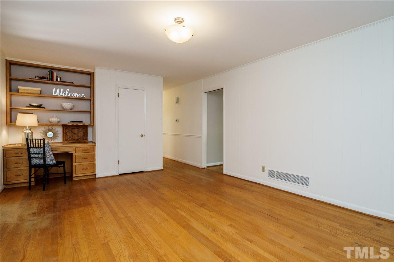 4224 Rowan Street Raleigh, NC 27609 - Photo 9 of 24 a view of empty room with furniture and wooden floor