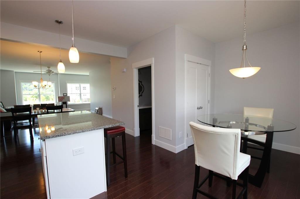 5 Laurel Hill Road, Unit 5 Brookfield, CT 06804 - Photo 1 of 1 a view of a dining room with furniture a chandelier and wooden floor
