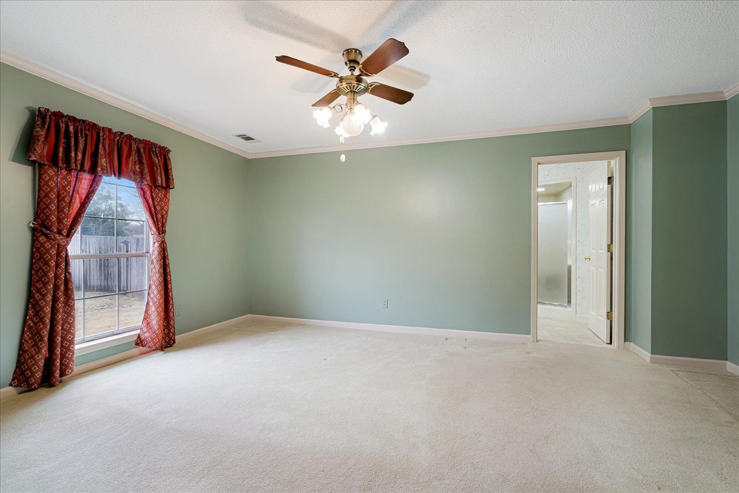 489 Autumn Trail Cove Collierville, TN 38017 - Photo 19 of 30 an empty room with ceiling fan and window