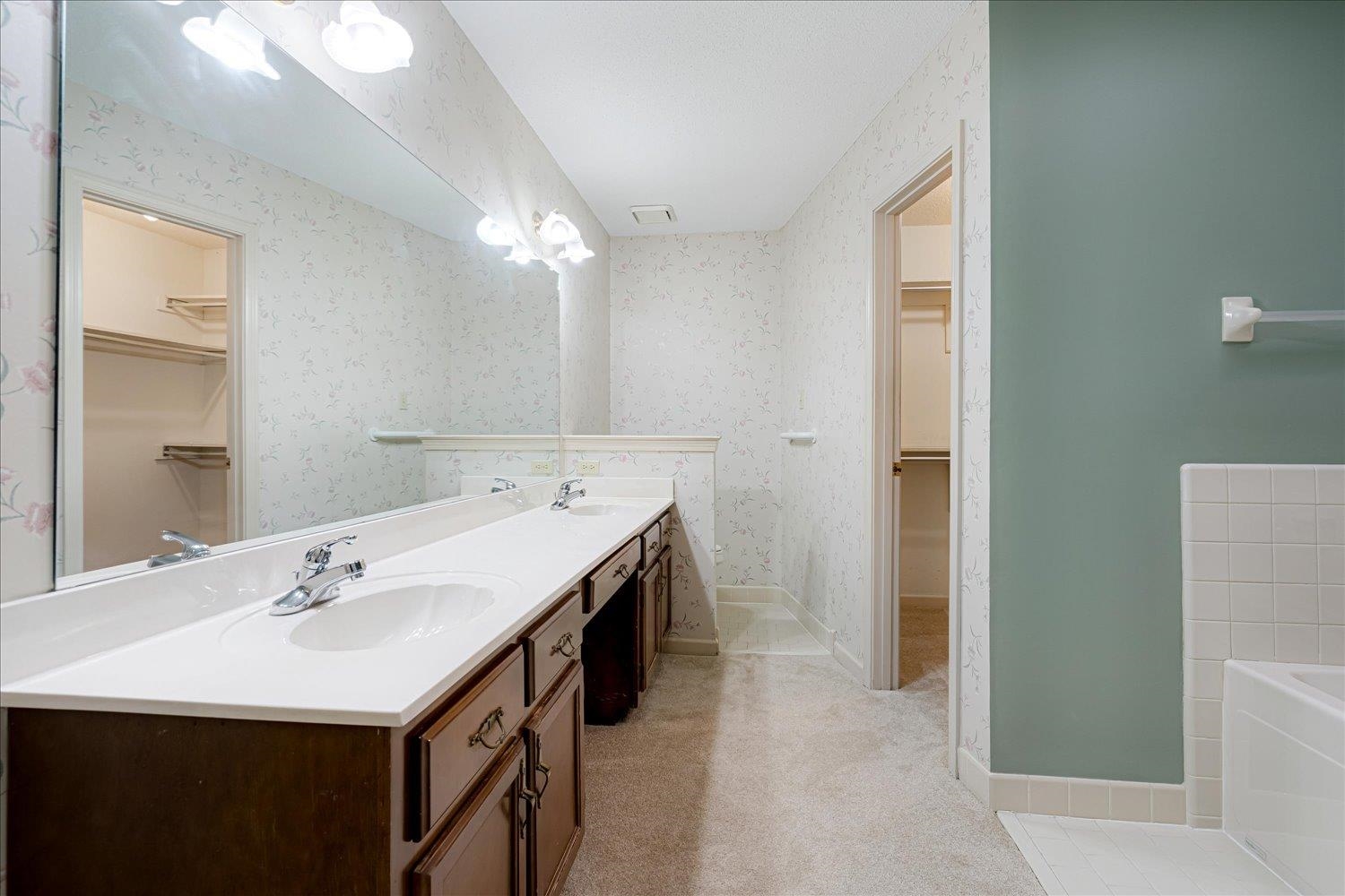 489 Autumn Trail Cove Collierville, TN 38017 - Photo 21 of 30 a spacious bathroom with a sink a mirror and a shower