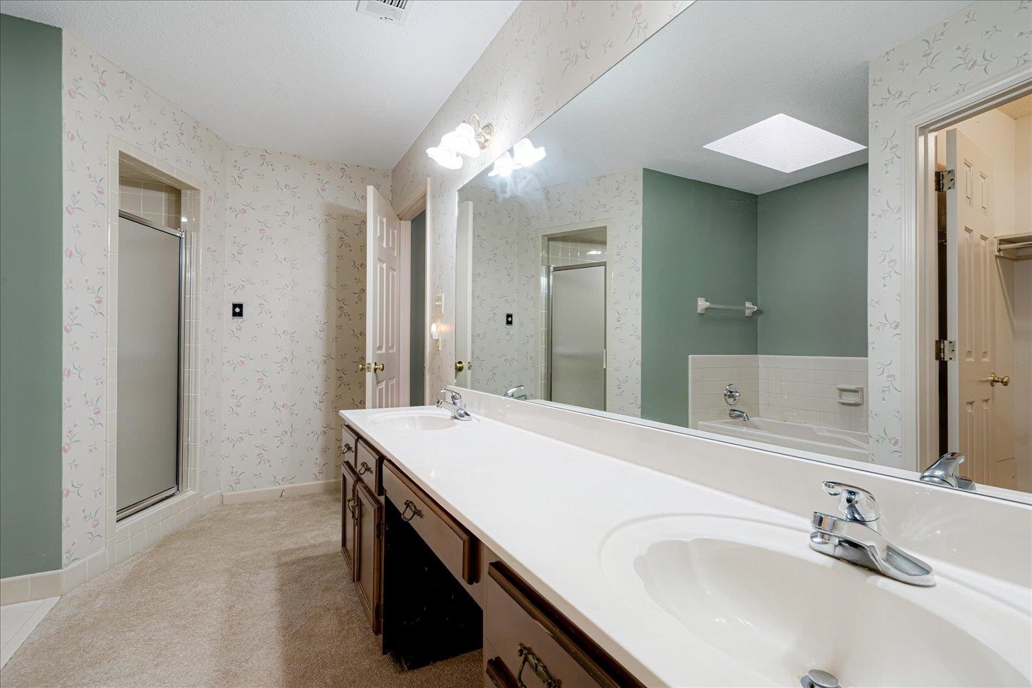 489 Autumn Trail Cove Collierville, TN 38017 - Photo 22 of 30 a bathroom with a sink vanity and a mirror