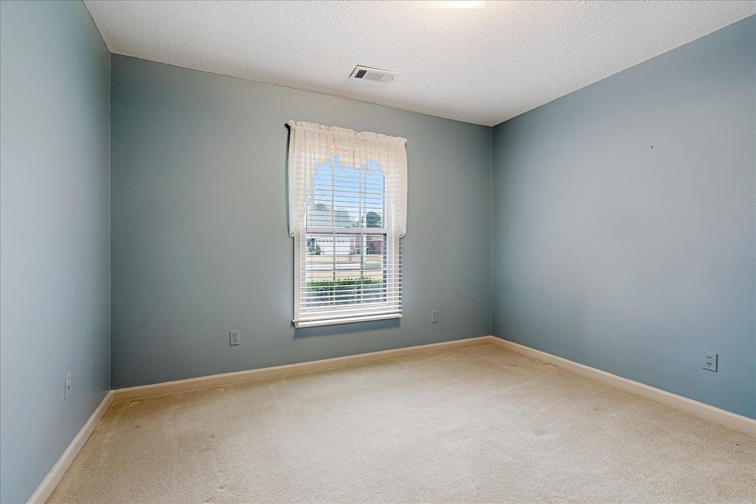 489 Autumn Trail Cove Collierville, TN 38017 - Photo 23 of 30 a view of an empty room with a window
