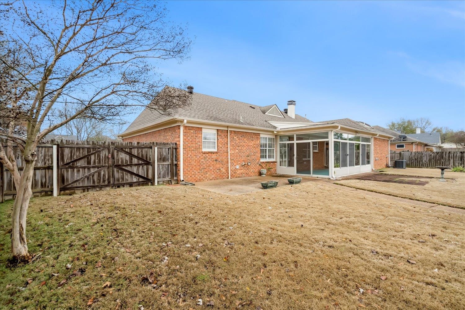 489 Autumn Trail Cove Collierville, TN 38017 - Photo 26 of 30 a front view of a house with a yard
