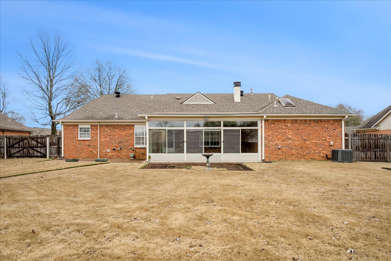 489 Autumn Trail Cove Collierville, TN 38017 - Photo 27 of 30 a front view of a house with a yard and garage