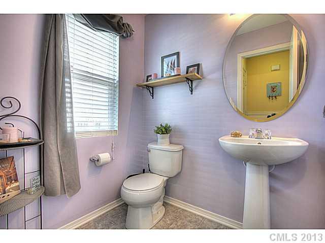 661 Potter Place Road, Unit 106 Fort Mill, SC 29708 - Photo 7 of 16 a bathroom with a toilet sink and mirror