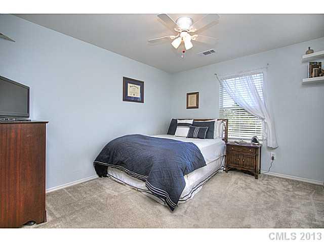 661 Potter Place Road, Unit 106 Fort Mill, SC 29708 - Photo 8 of 16 a living room with a bed furniture and a window