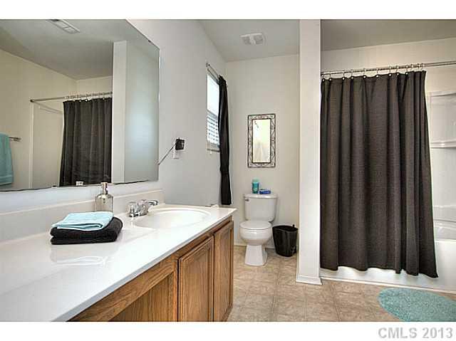 661 Potter Place Road, Unit 106 Fort Mill, SC 29708 - Photo 9 of 16 a bathroom with a sink and a mirror