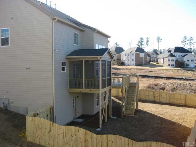 2101 Lower Lake Road Wake Forest, NC 27587 - Photo 5 of 12 (view from home next door) Screened porch w ceiling fan & fenced in backyard!