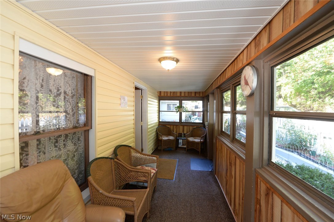 444 Selzer Street Akron, OH 44310 - Photo 16 of 35 Waste away a day on this comfortable enclosed front porch