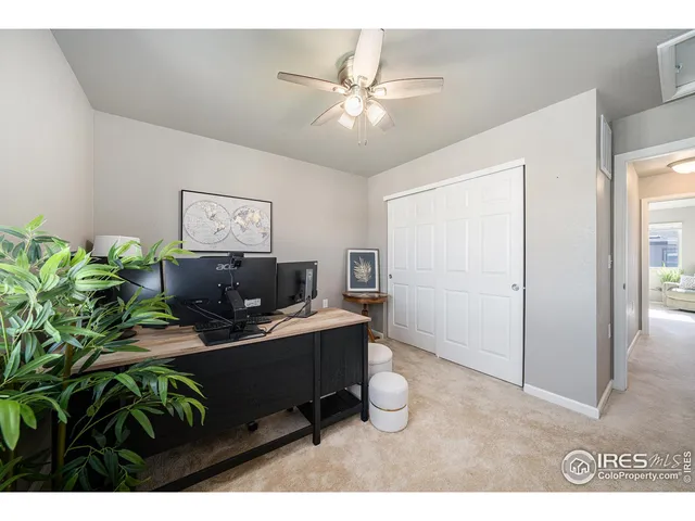 a workspace with furniture and window