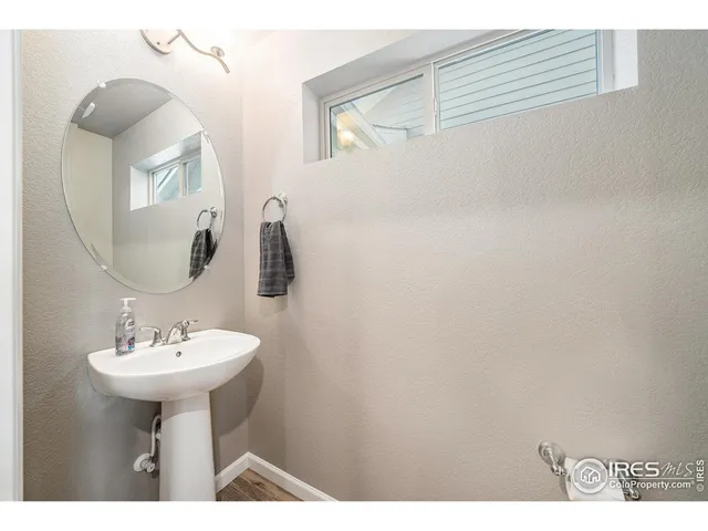 a bathroom with a sink a mirror and a shower