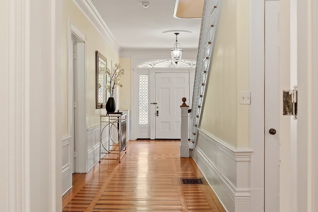 23 Lewis Road Concord, MA 01742 - Photo 5 of 42 a view of a hallway view with wooden floor and staircase