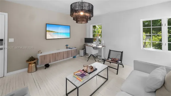 a living room with furniture and a large window