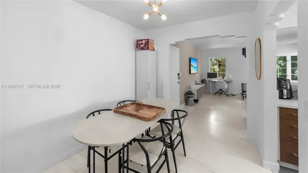a view of a livingroom with furniture and a chandelier