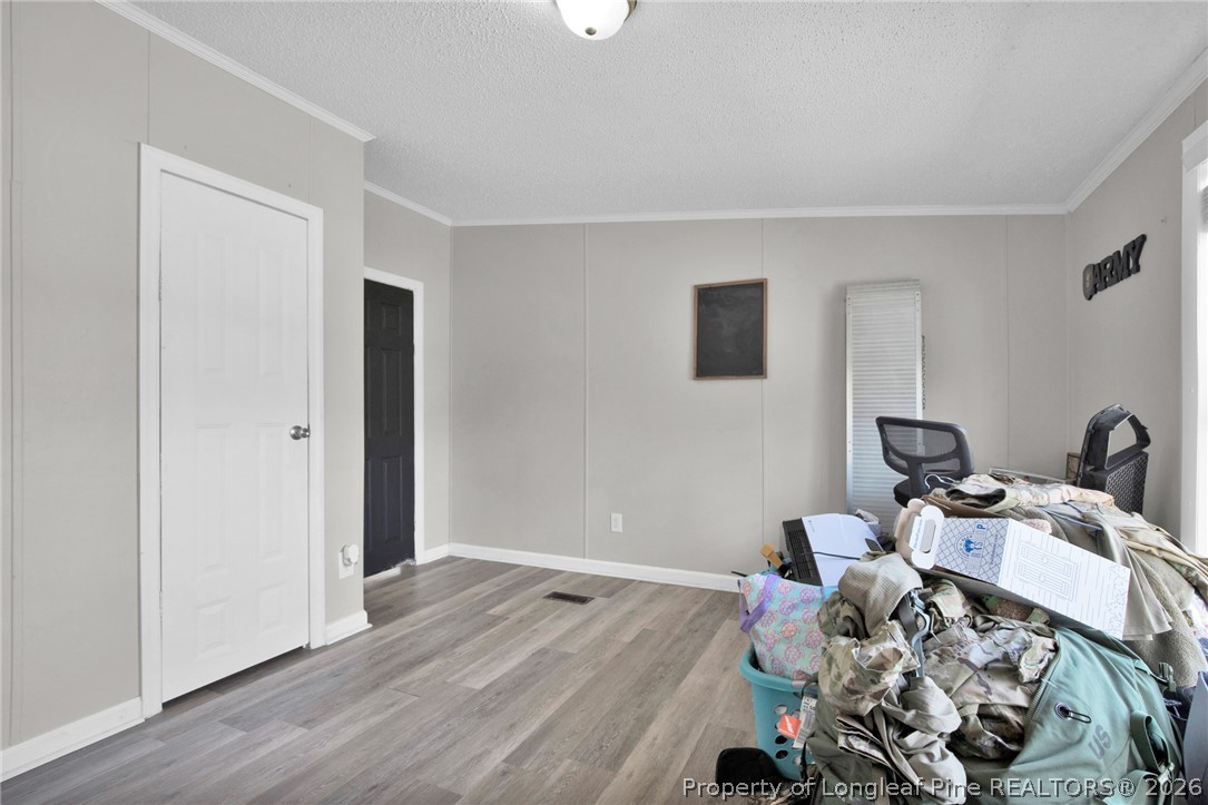 518 Inverary Drive Raeford, NC 28376 - Photo 23 of 30 a view of a workspace with wooden floor