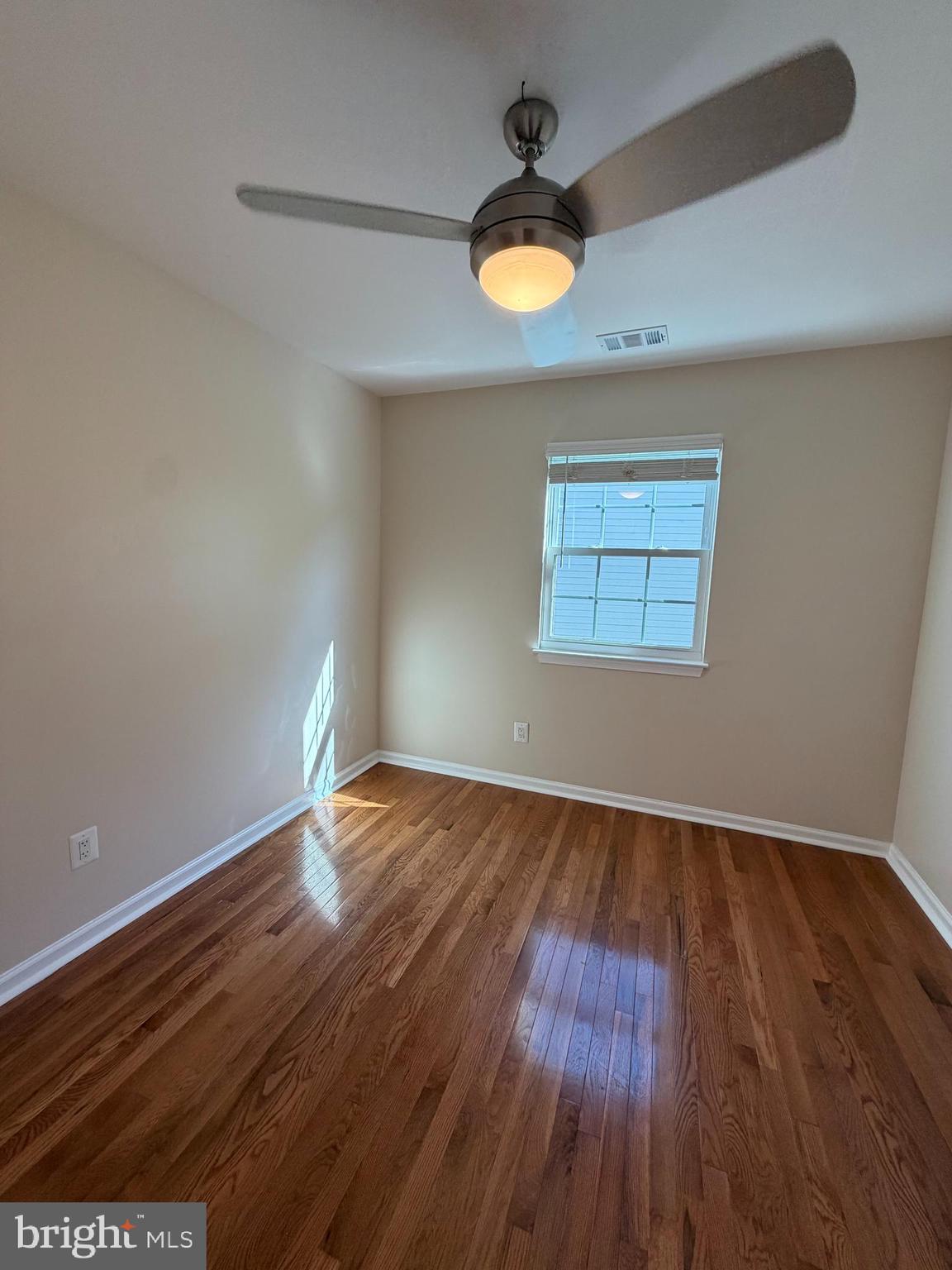 13952 Bishops Bequest Road Upper Marlboro, MD 20772 - Photo 14 of 28 an empty room with wooden floor and windows
