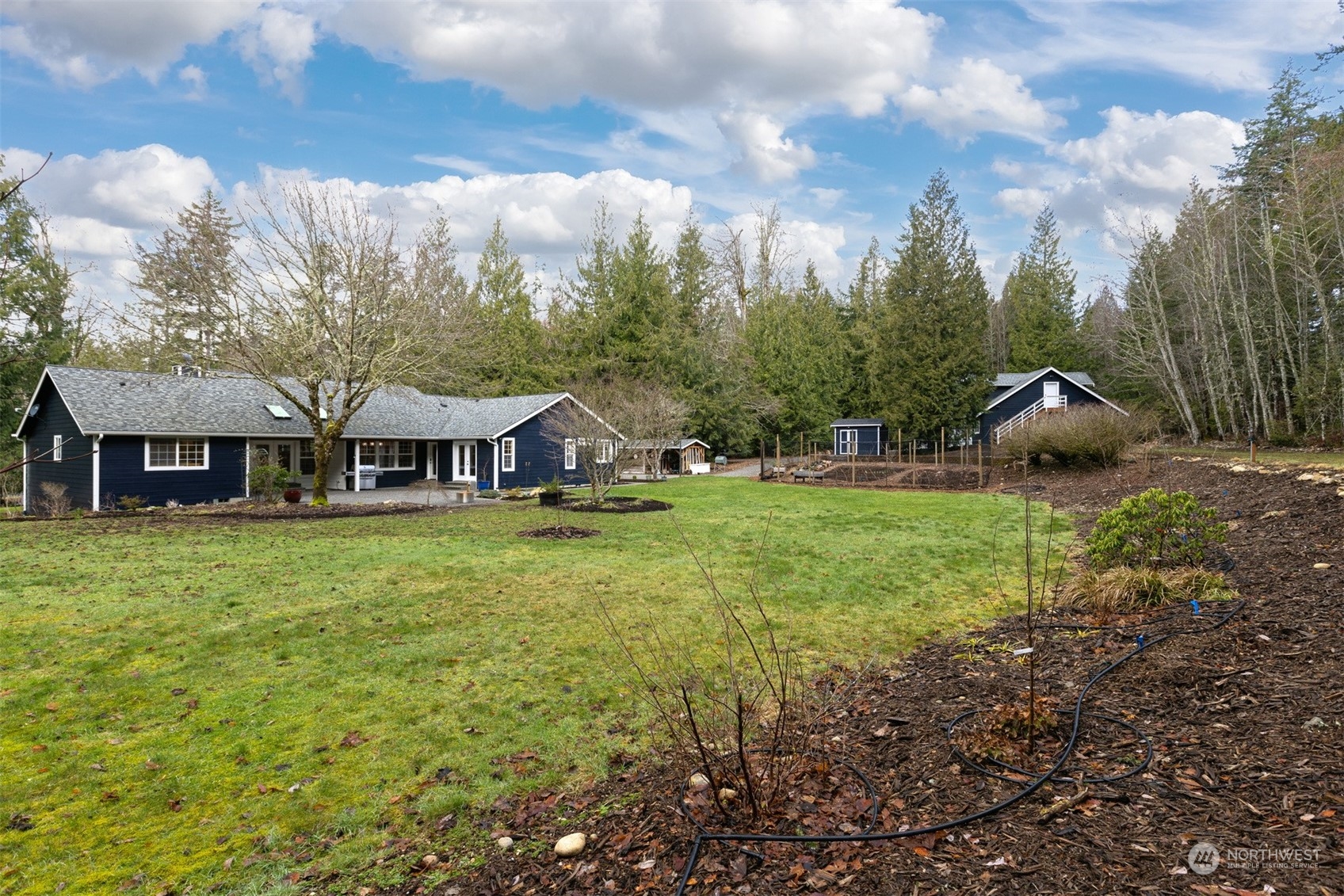 3313 Y Road Bellingham, WA 98226 - Photo 24 of 40 a view of a big house with a big yard and large trees
