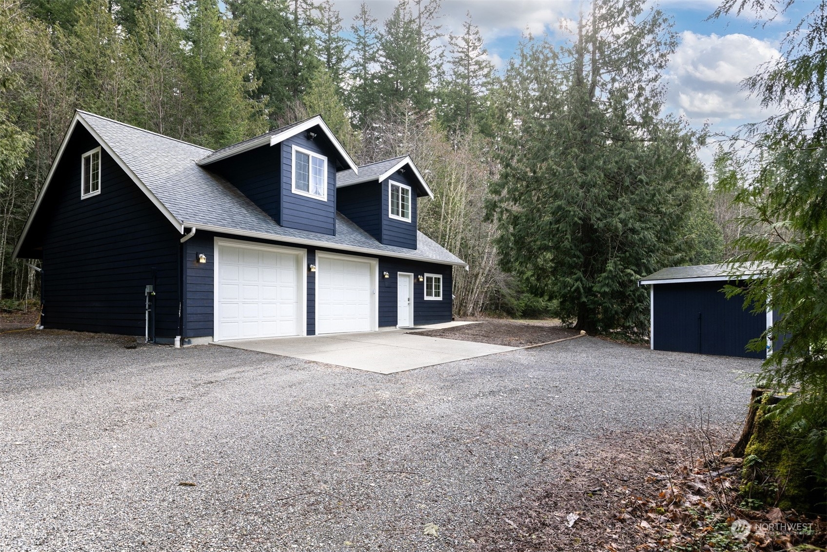 3313 Y Road Bellingham, WA 98226 - Photo 27 of 40 a front view of a house with a yard and garage