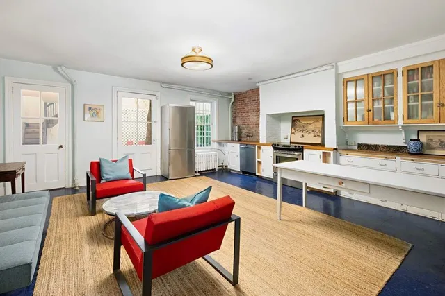 a bedroom with a bed and a book shelf