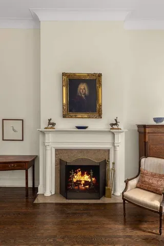 a living room with furniture fireplace and a flat screen tv