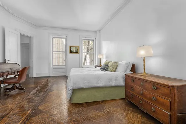 a living room with furniture a rug and a fireplace