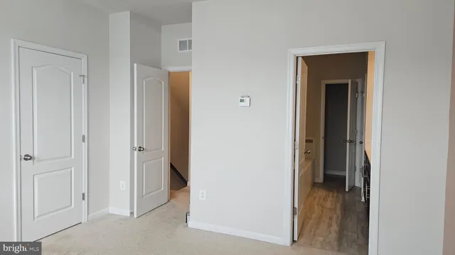 a view of a bathroom from a hallway