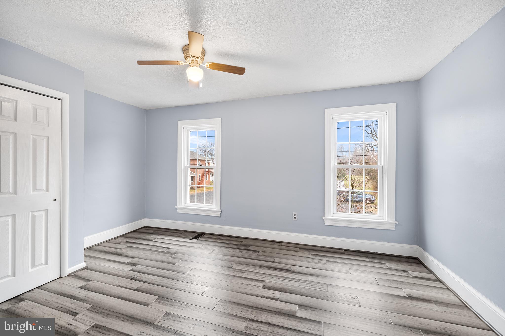 329 South Hanover Street Pottstown, PA 19465 - Photo 11 of 23 a view of an empty room with wooden floor and a window