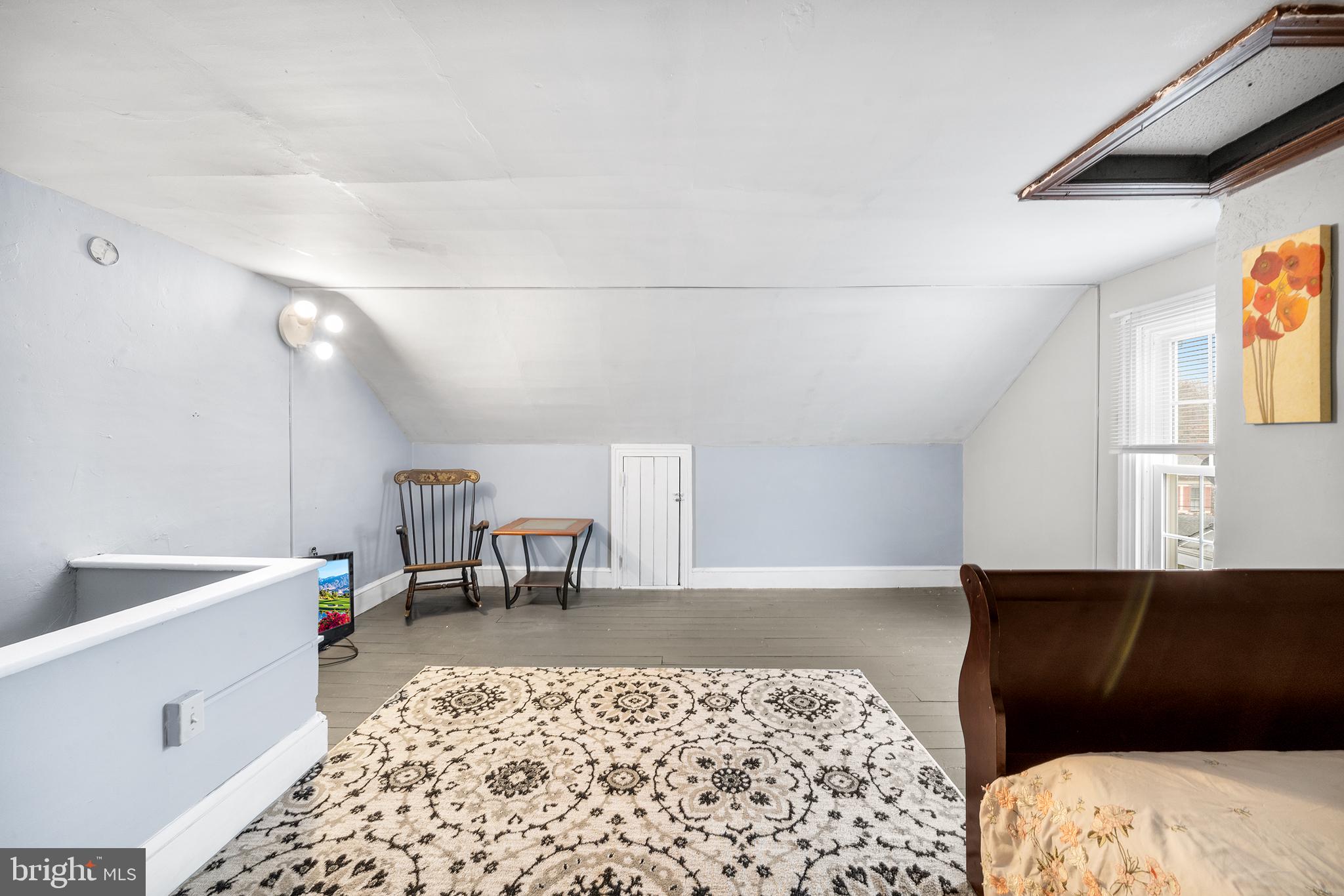 329 South Hanover Street Pottstown, PA 19465 - Photo 16 of 23 a bed room with a bed and a chair