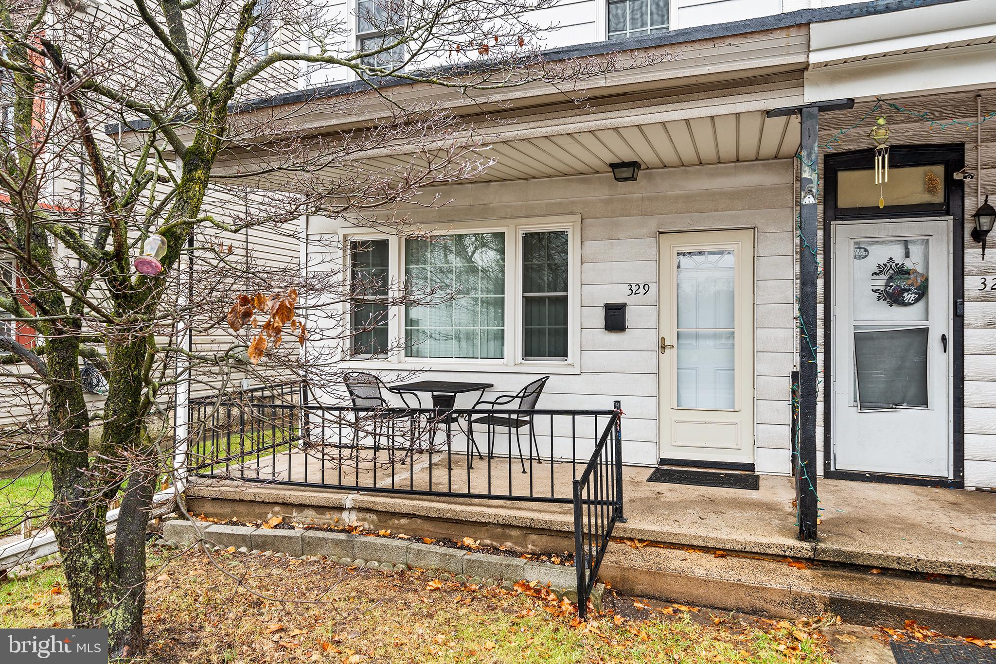 329 South Hanover Street Pottstown, PA 19465 - Photo 22 of 23 a view of a house with a wooden deck and a tree