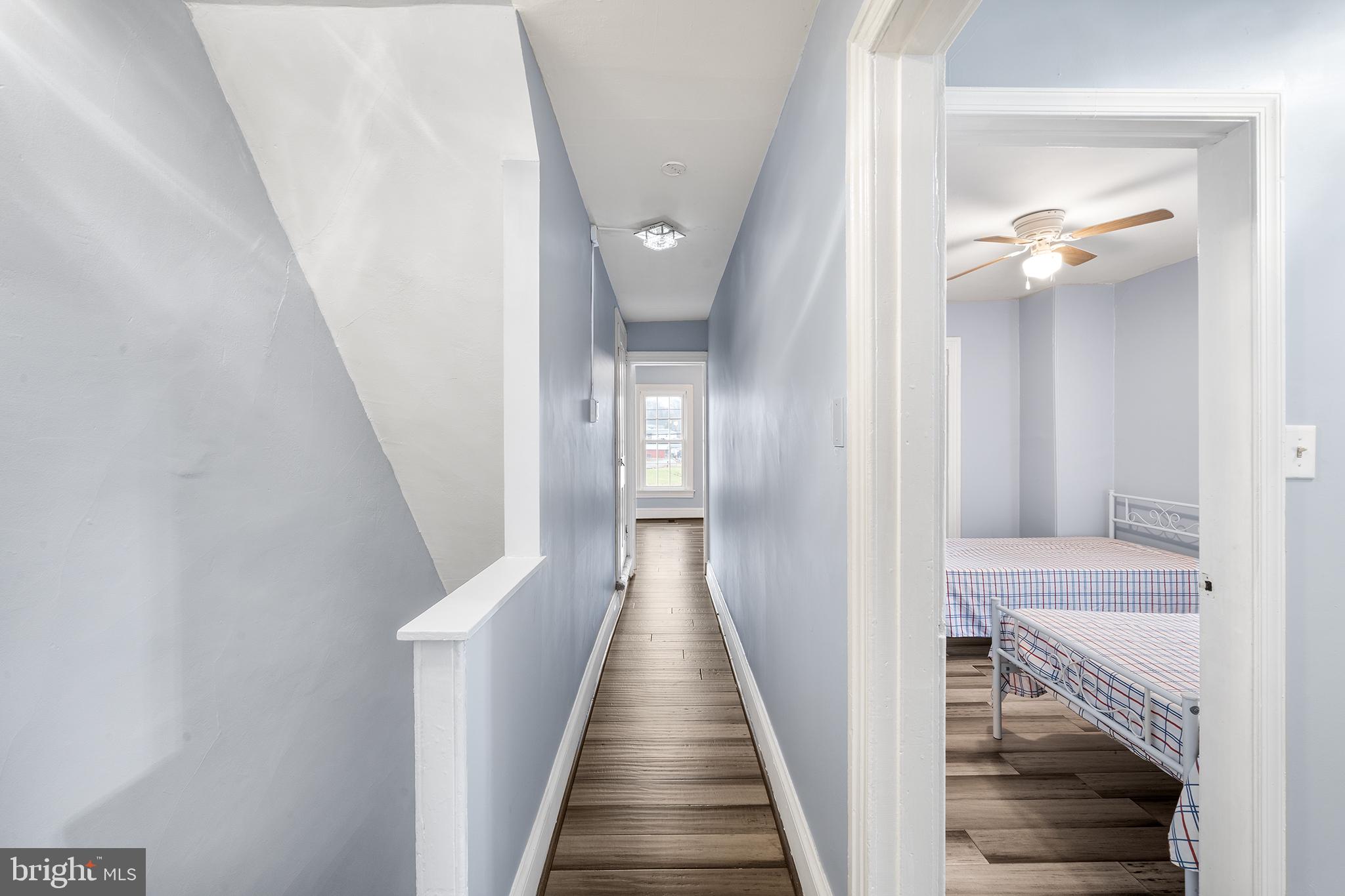 329 South Hanover Street Pottstown, PA 19465 - Photo 10 of 23 a view of a hallway with wooden floor and staircase