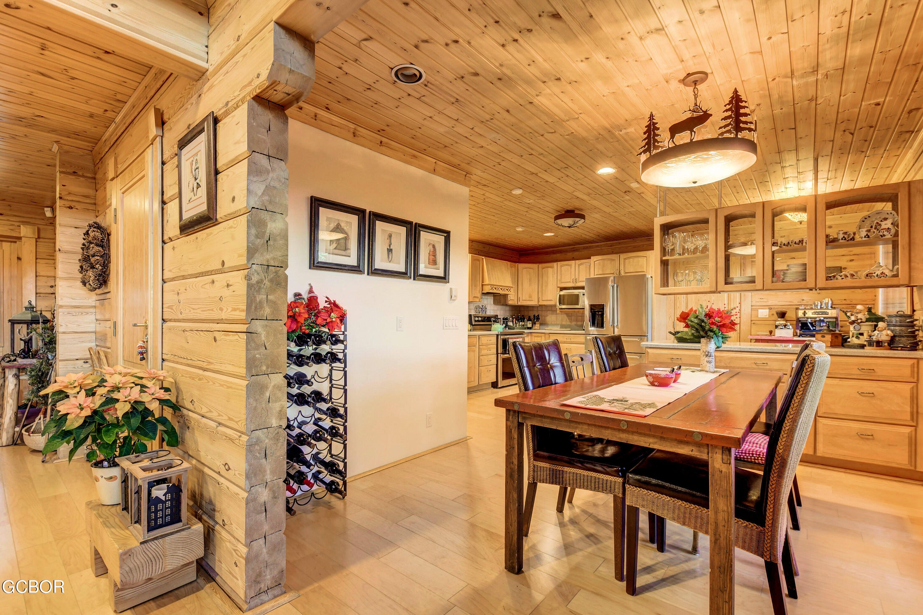 11006 Timothys Drive Conifer, CO 80433 - Photo 18 of 45 a dining room with furniture and a potted plant
