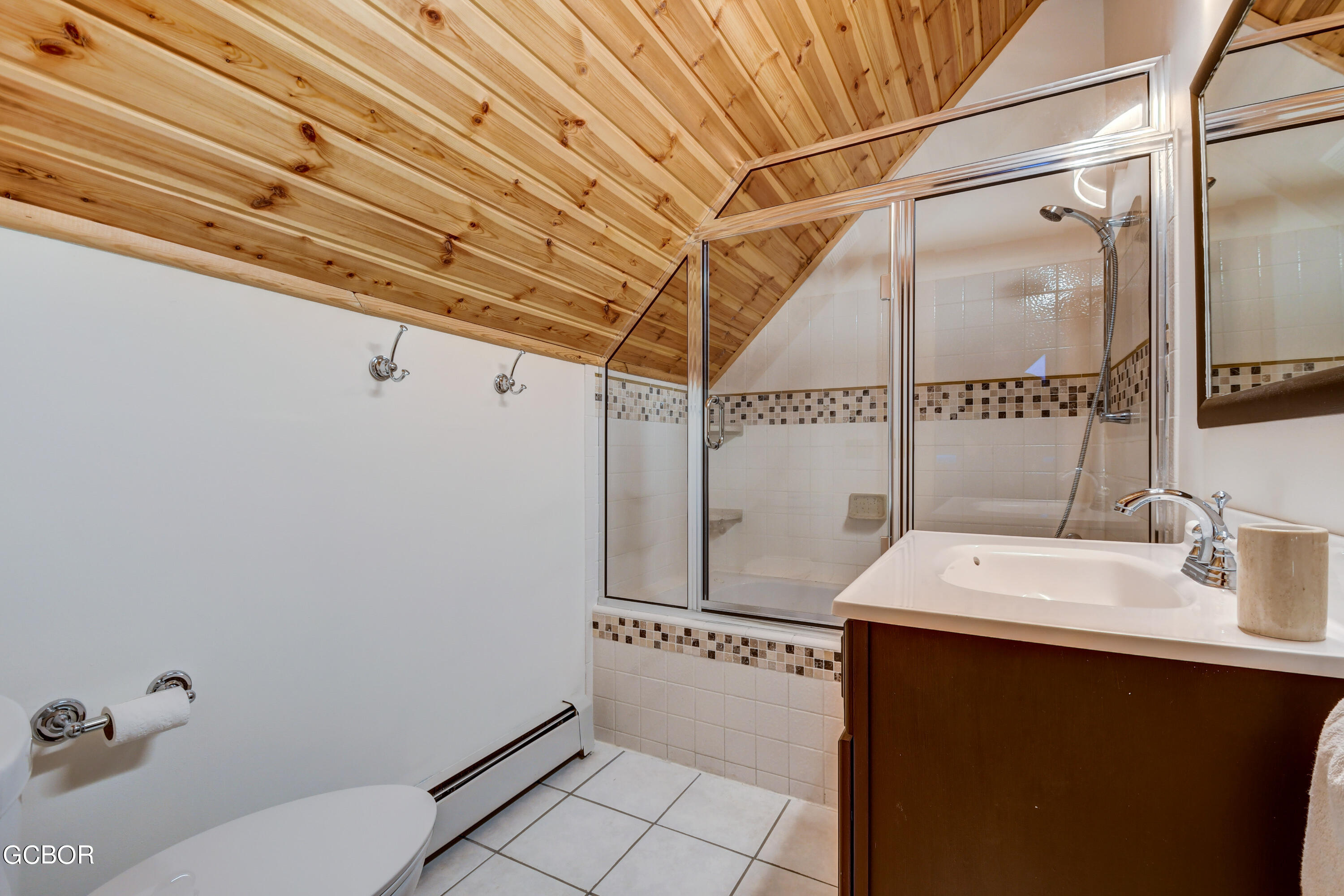 11006 Timothys Drive Conifer, CO 80433 - Photo 27 of 45 a bathroom with a sink a toilet and shower