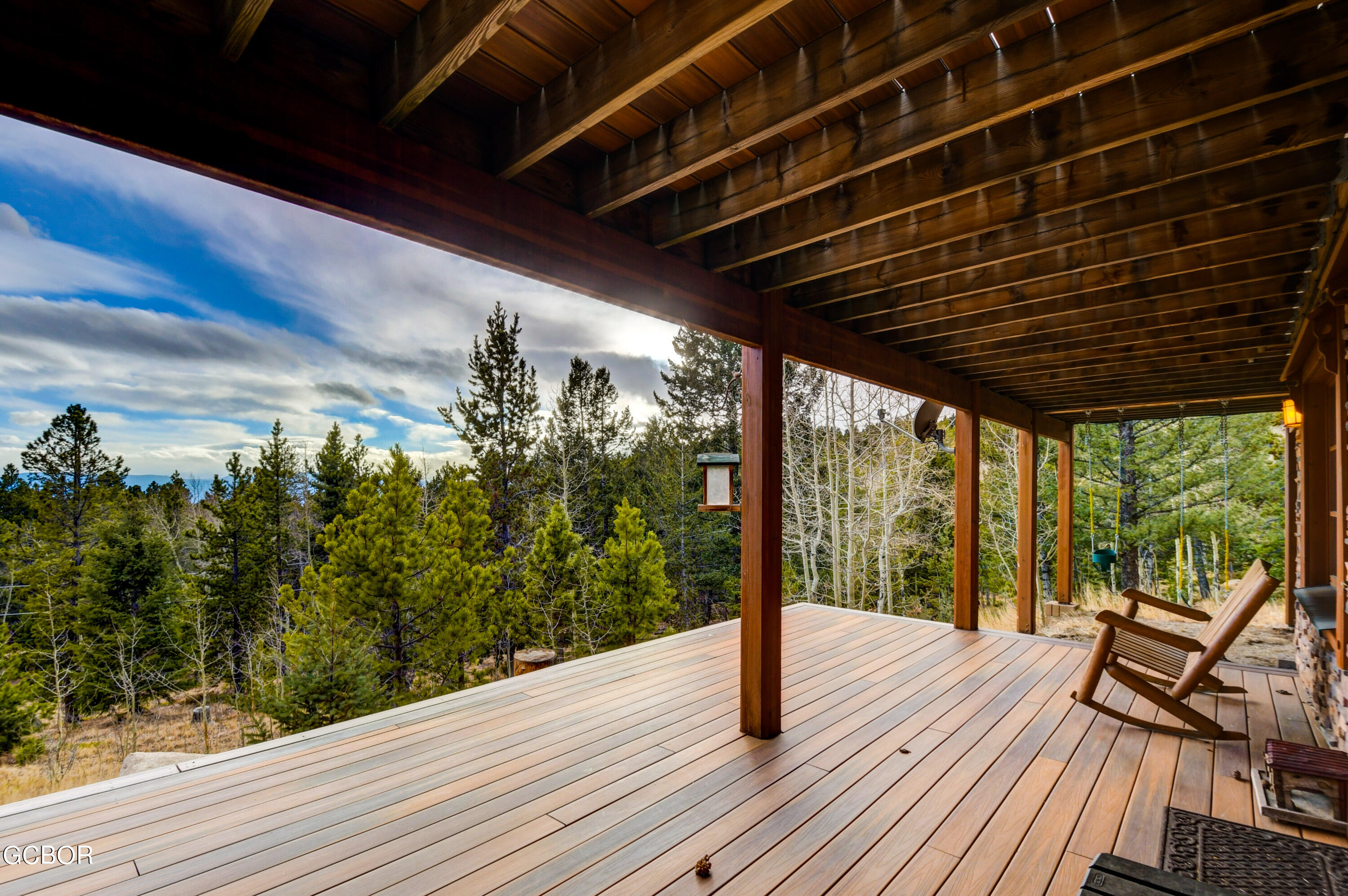 11006 Timothys Drive Conifer, CO 80433 - Photo 35 of 45 a view of a balcony with wooden floor