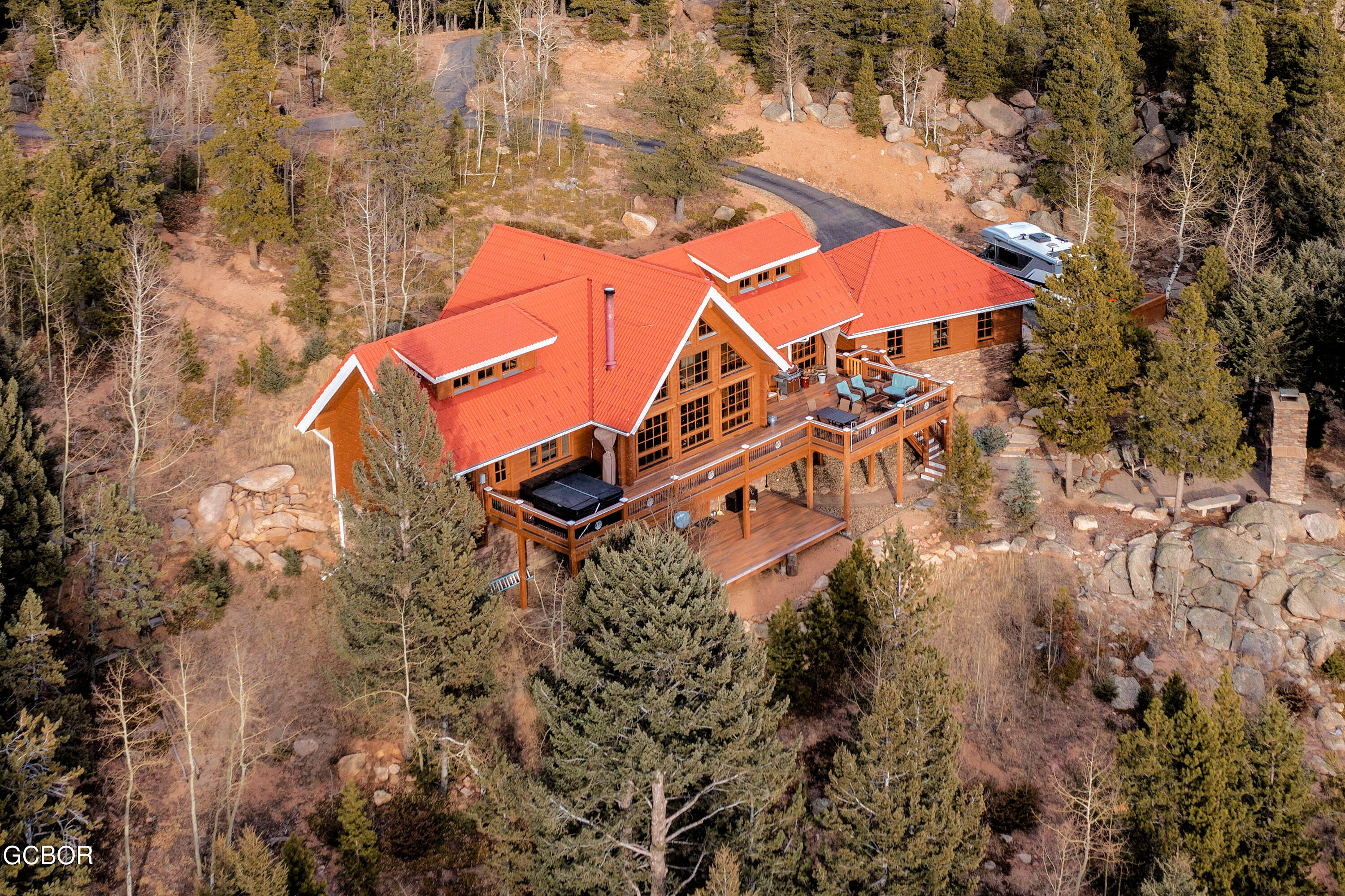 11006 Timothys Drive Conifer, CO 80433 - Photo 39 of 45 an aerial view of a house with a yard and trees