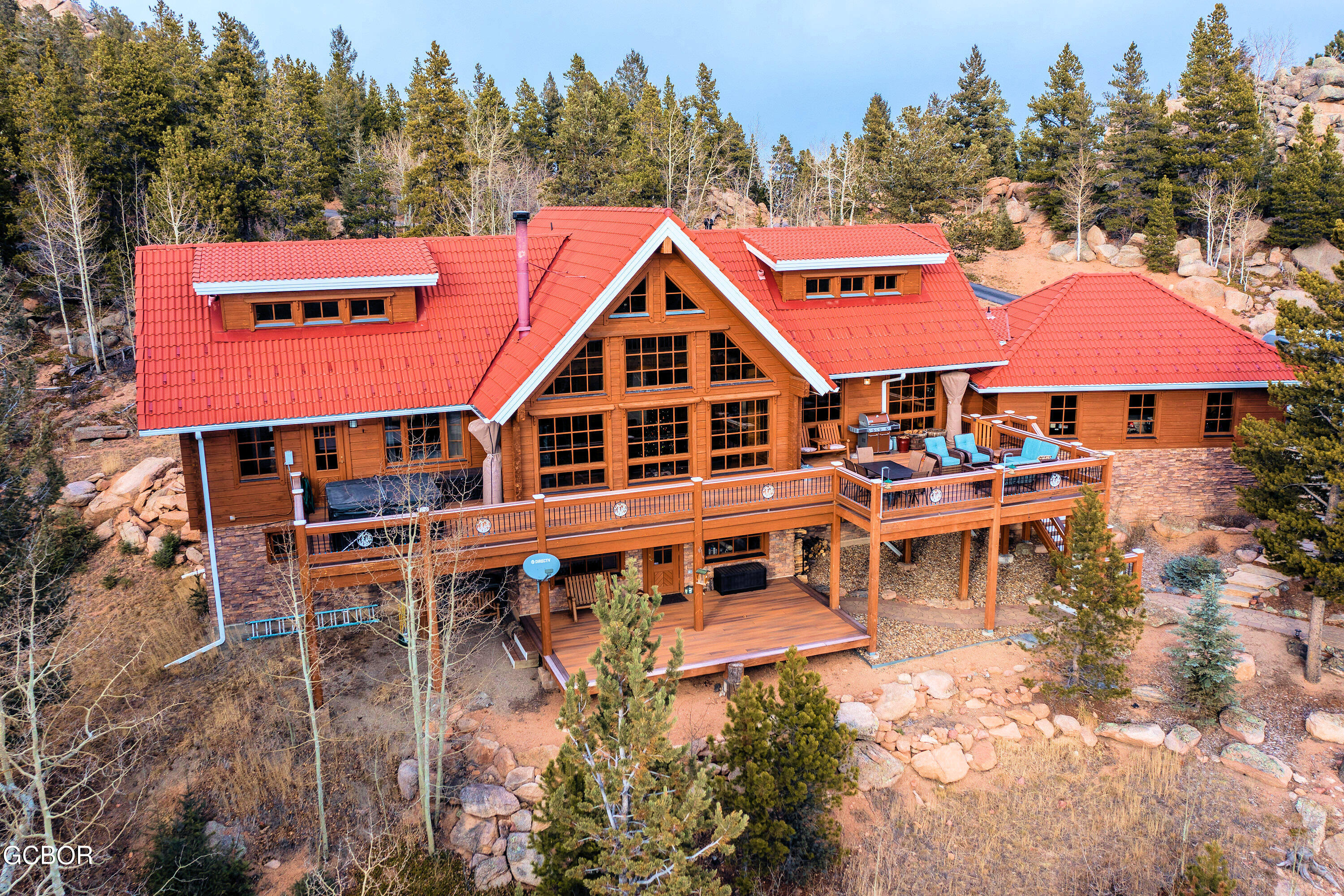 11006 Timothys Drive Conifer, CO 80433 - Photo 40 of 45 a aerial view of a house with swimming pool and sitting area