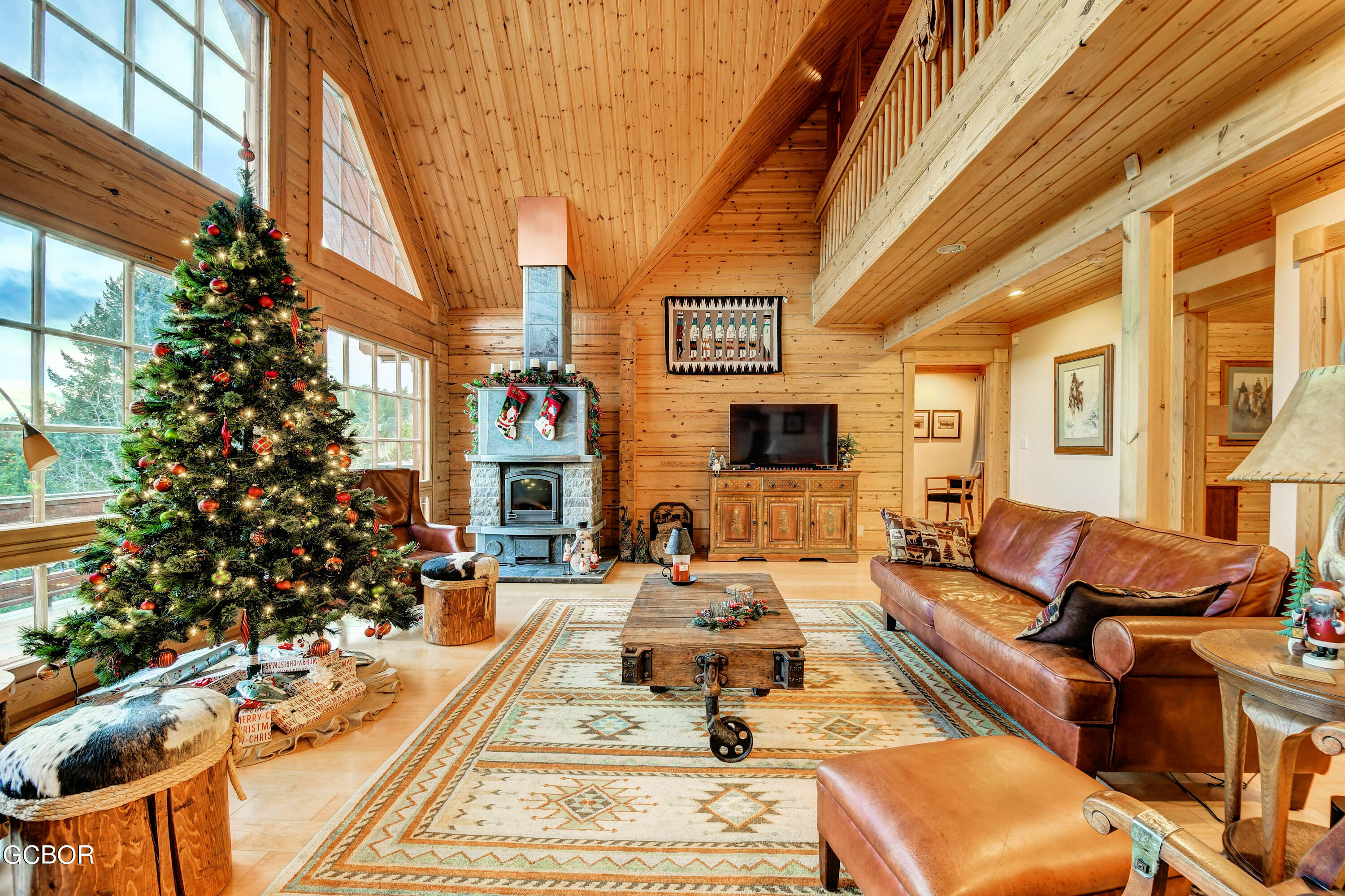 11006 Timothys Drive Conifer, CO 80433 - Photo 10 of 45 a view of a patio with couches chairs and a potted plant