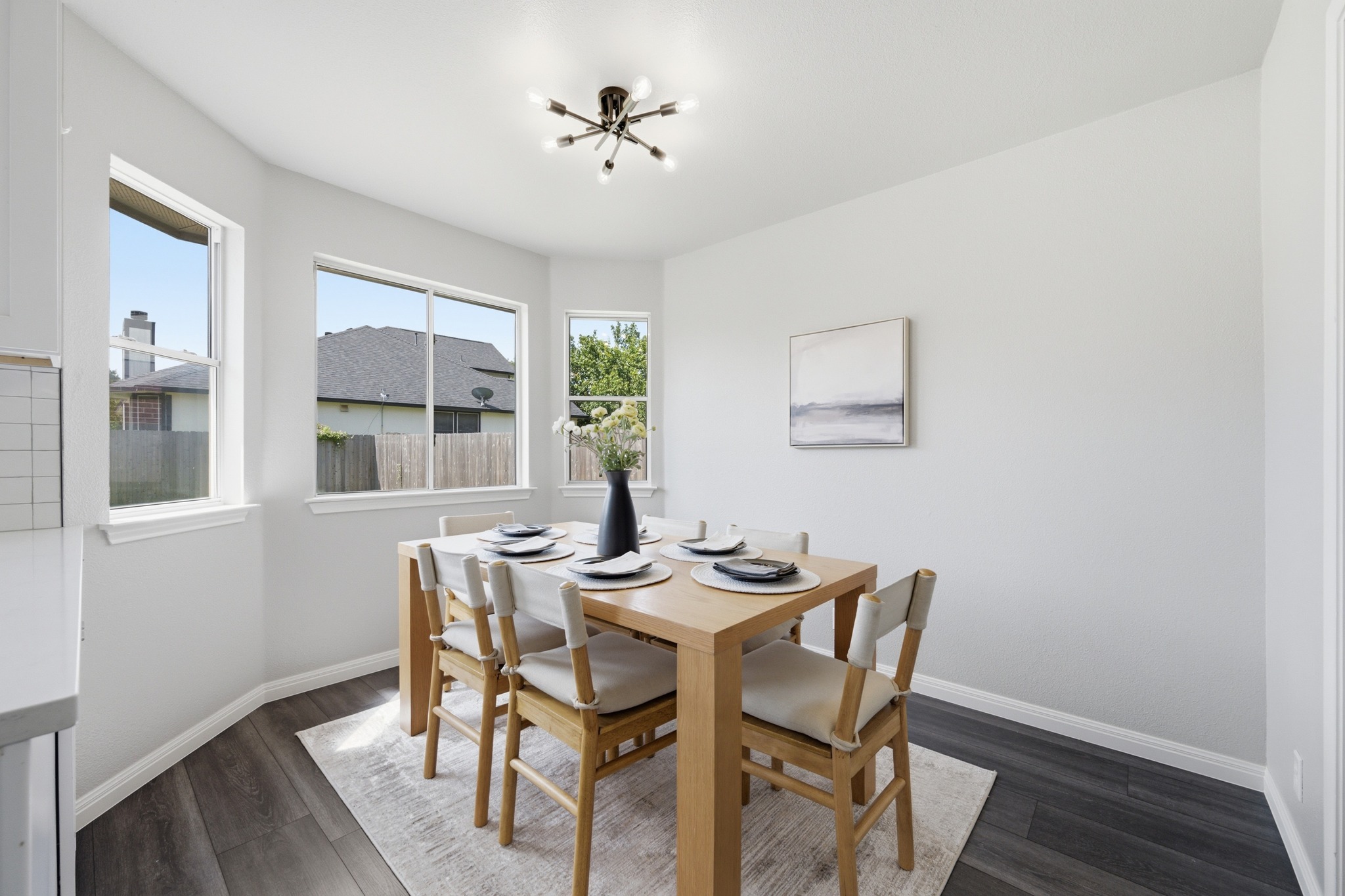 1504 Waterfall Avenue Leander, TX 78641 - Photo 11 of 25 A cheerful breakfast nook surrounded by windows and natural light.