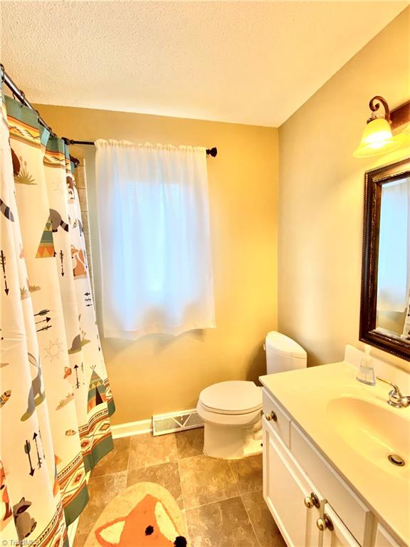 8318 Mccrory Road Stokesdale, NC 27357 - Photo 14 of 30 Hall bathroom