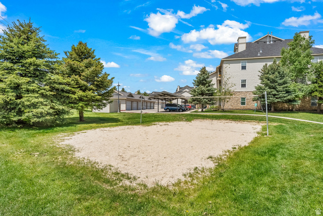 900 Bitner Road, Unit K25 Park City, UT 84098 - Photo 24 of 35 Outdoor sand volleyball court surrounded by manicured green lawn