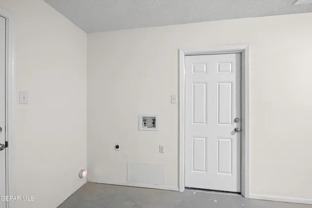 a kitchen with a sink cabinets and wooden floor