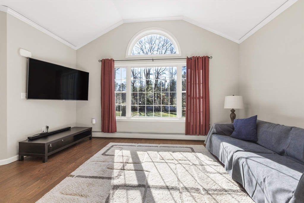 204 Brookfield Road Charlton, MA 01507 - Photo 11 of 36 a living room with furniture a flat screen tv and a window