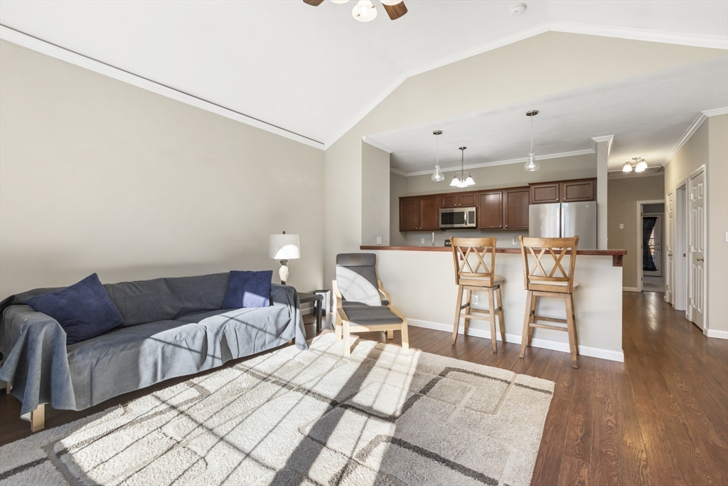 204 Brookfield Road Charlton, MA 01507 - Photo 12 of 36 a living room with furniture and kitchen view