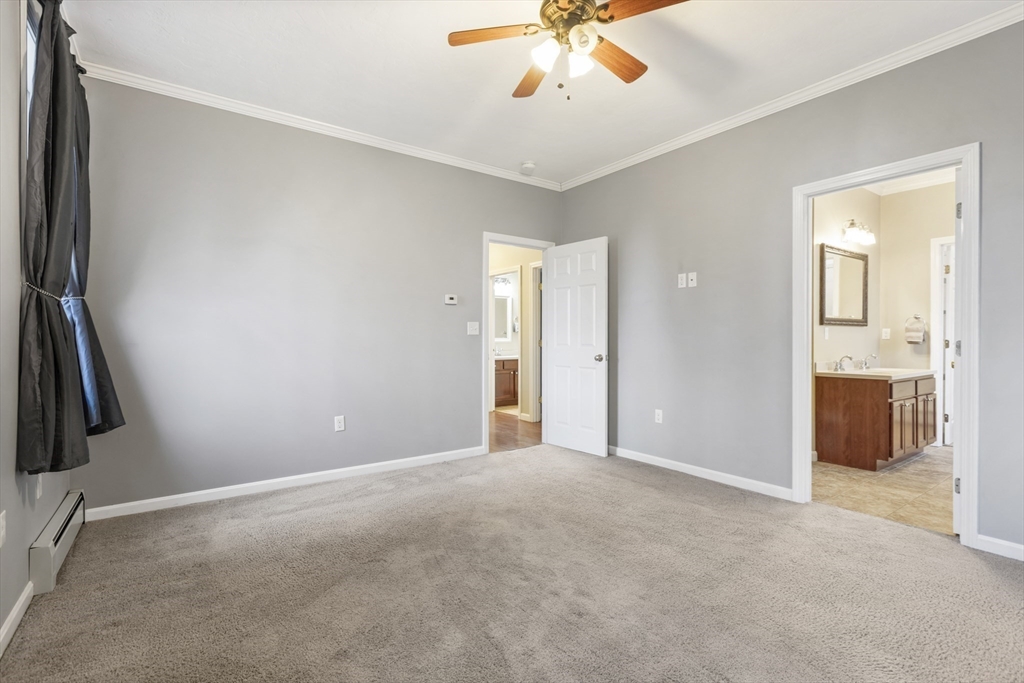 204 Brookfield Road Charlton, MA 01507 - Photo 18 of 36 a view of a big room with closet and a chandelier fan